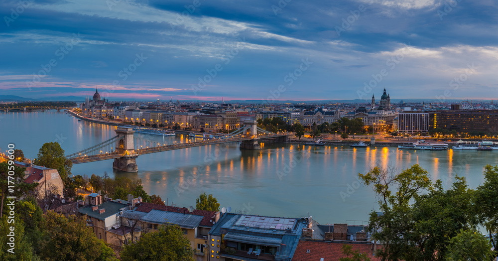 Budapest, Hungary - Panoramic skyline view of Budapest taken from Buda Castle at dawn. This view includes Szechenyi Chain Bridge, St Stephen's basilica and Parliament of Hungary