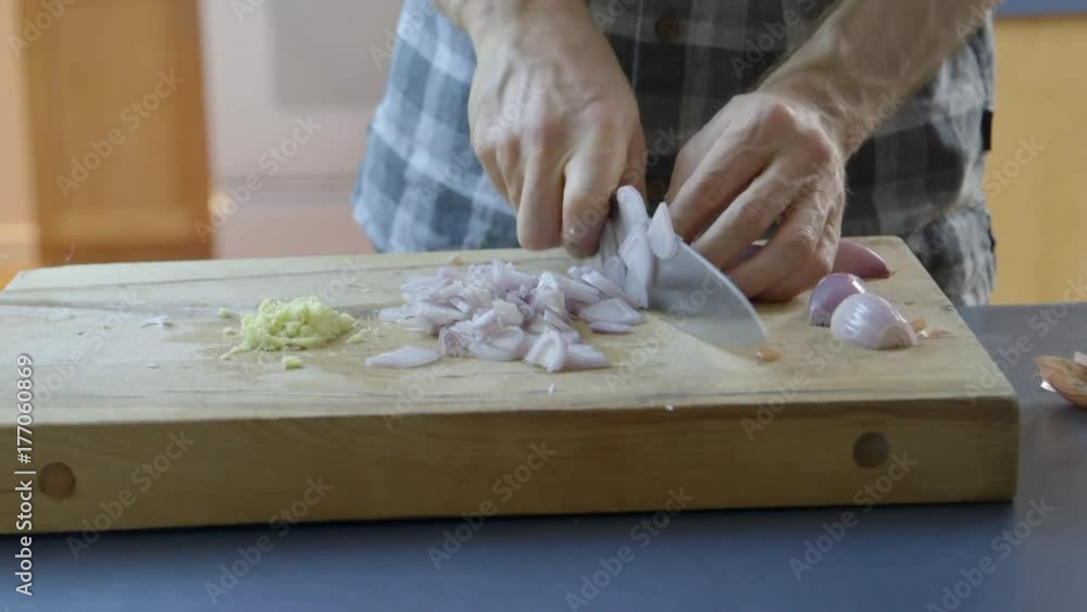 Close up: Preparing onion to cook Close up: Preparing onion to cook