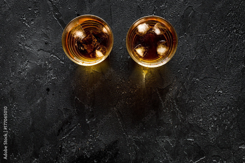 Alcohol cocktails with whiskey and ice black bar background top view mockup Alcohol cocktails with whiskey and ice black bar background top view mockup