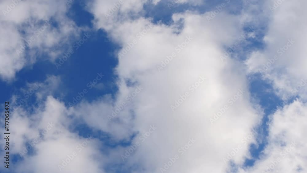 Fluffy White Clouds Float Across The Blue Sky Fluffy White Clouds Float Across The Blue Sky