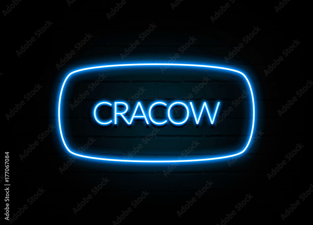 Cracow - colorful Neon Sign on brickwall Cracow - colorful Neon Sign on brickwall