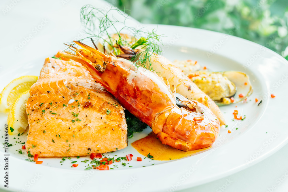 Mixed grilled seafood steak with salmon prawn and other meat Mixed grilled seafood steak with salmon prawn and other meat
