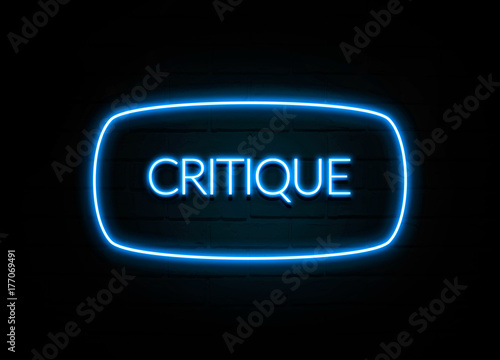 Critique  - colorful Neon Sign on brickwall