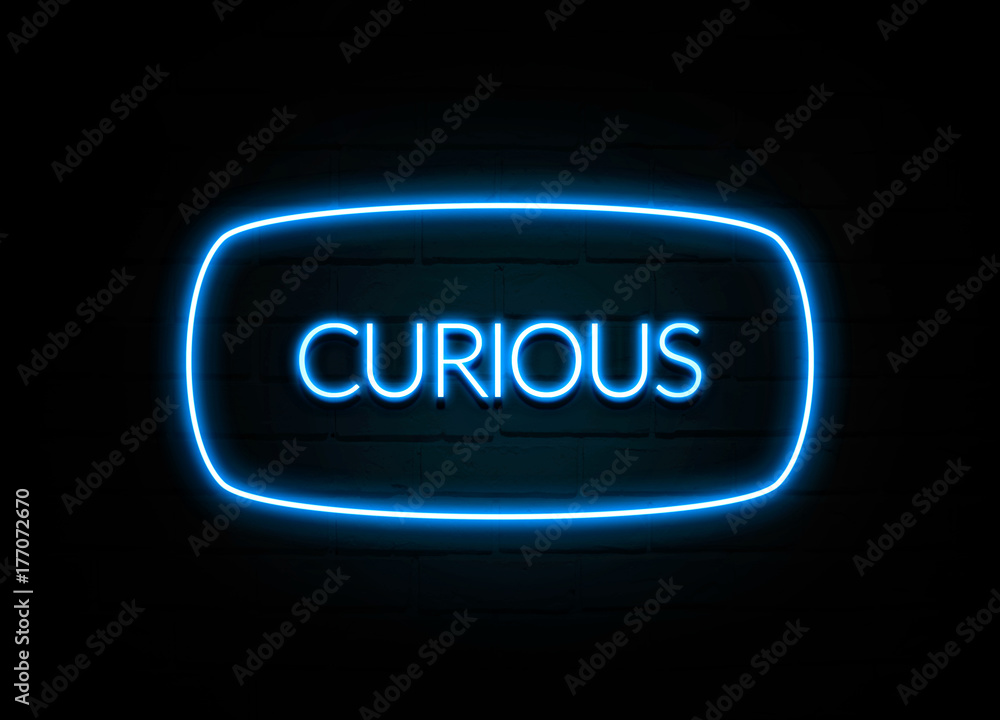 Curious - colorful Neon Sign on brickwall Curious - colorful Neon Sign on brickwall