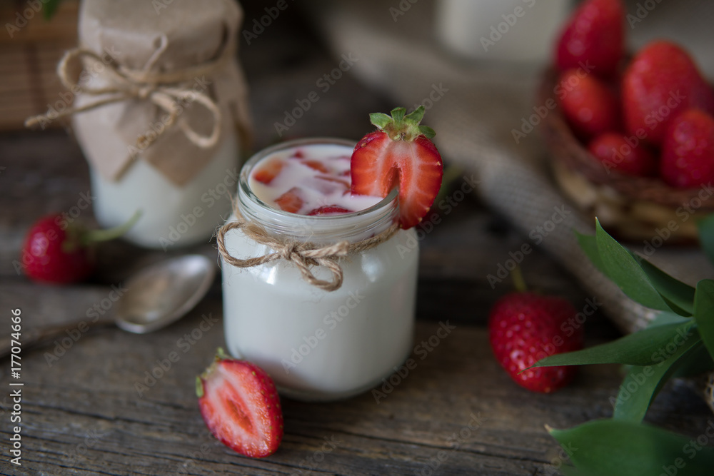 Organic yougurt in jar with strawberry. Fresh strawberry with yogurt Organic yougurt in jar with strawberry. Fresh strawberry with yogurt