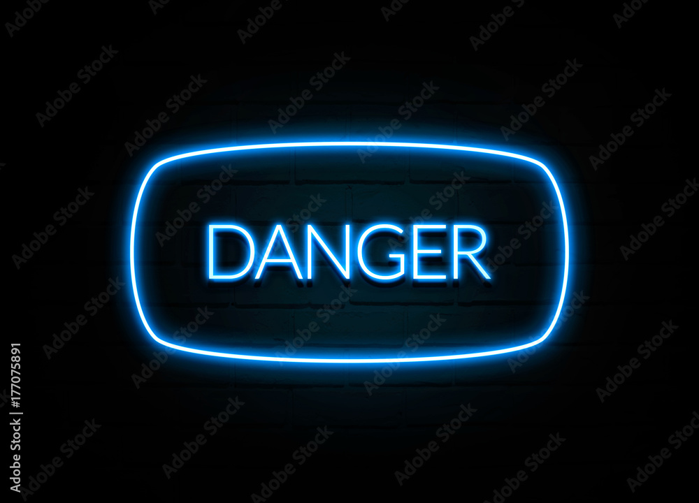 Danger - colorful Neon Sign on brickwall Danger - colorful Neon Sign on brickwall