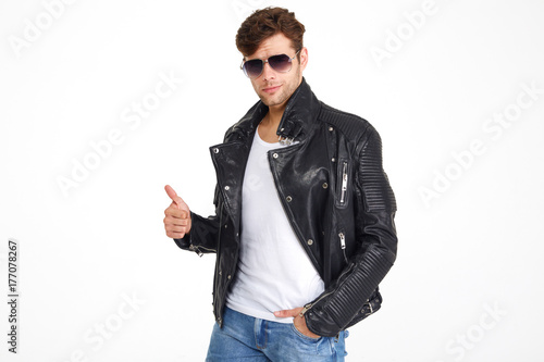 Obraz na plátně Portrait of a smiling handsome man in a leather jacket