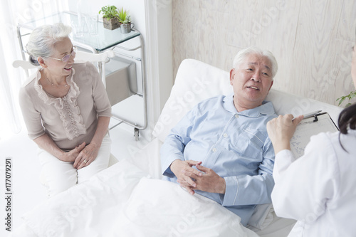Elderly patients listening to the test results to female doctors
