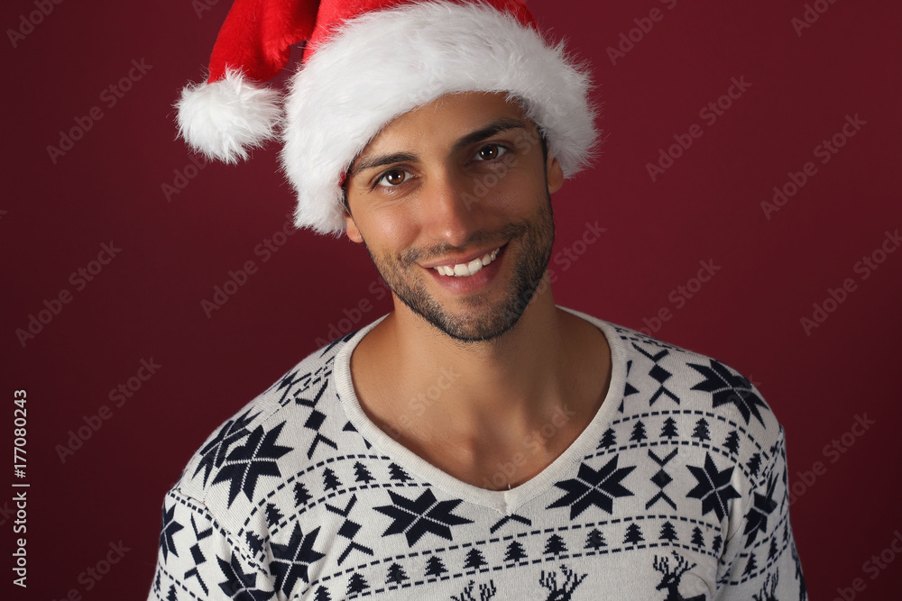 Handsome smiling man in santa hat Handsome smiling man in santa hat