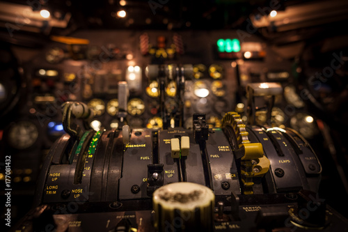 Control levers in airplane cockpit closeup with selective focus. photo