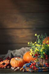 The table decorated with flowers and vegetables. Happy Thanksgiving Day. Autumn background.