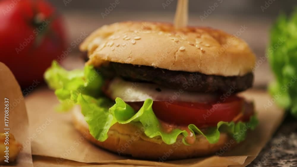 Fast food, American cuisine. Homemade hamburger with fries closeup. Fast food, American cuisine. Homemade hamburger with fries closeup.