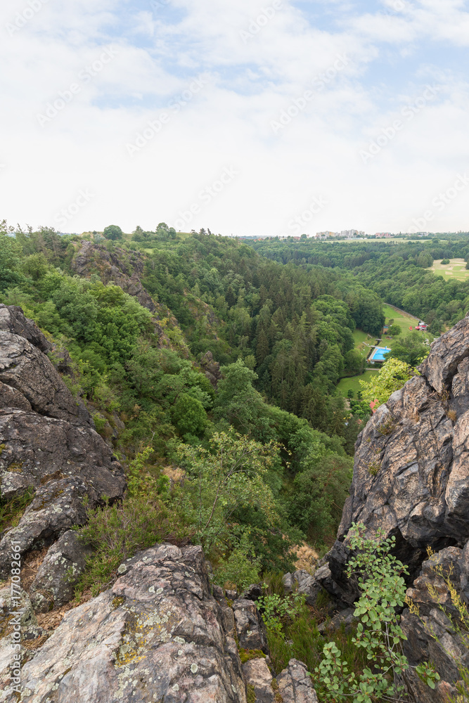 Lush gorge viewed from the rocky top at the Divoka Sarka. It's a nature reserve on the outskirts of Prague in Czech Republic. 