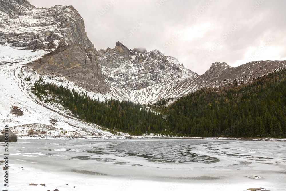 Upper Tombstone Lake and Snowy Mountain Top Landscape on Great Kananaskis Country Hiking Trail in Alberta Foothills near Banff National Park Canadian Rocky Mountains Upper Tombstone Lake and Snowy Mountain Top Landscape on Great Kananaskis Country Hiking Trail in Alberta Foothills near Banff National Park Canadian Rocky Mountains