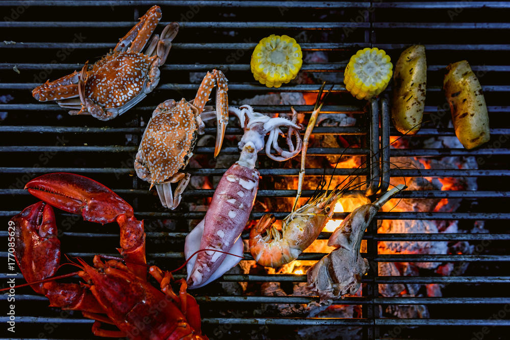 Lobster, crab, squid, prawn on charcoal grill