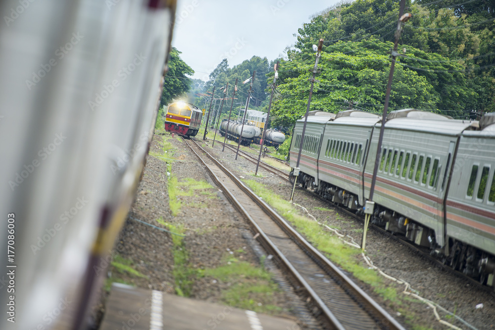Naklejka premium Railway officials are managing train traffic in Thailand.
