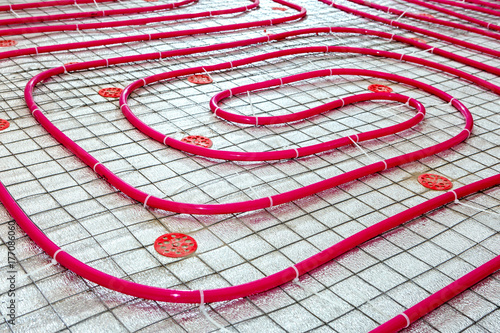 Floor heating pipe. Installation of engineering systems in a building.