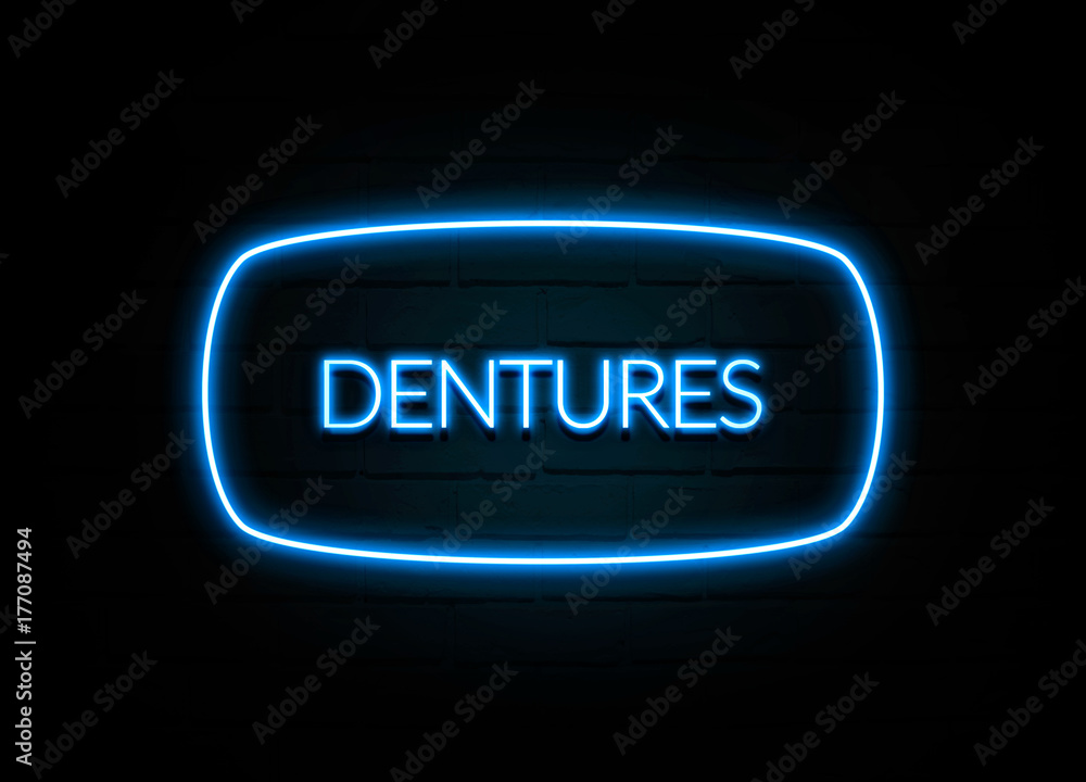 Dentures - colorful Neon Sign on brickwall Dentures - colorful Neon Sign on brickwall