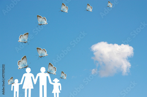 Blue butterflies flying on a family with blue sky background welfare concept