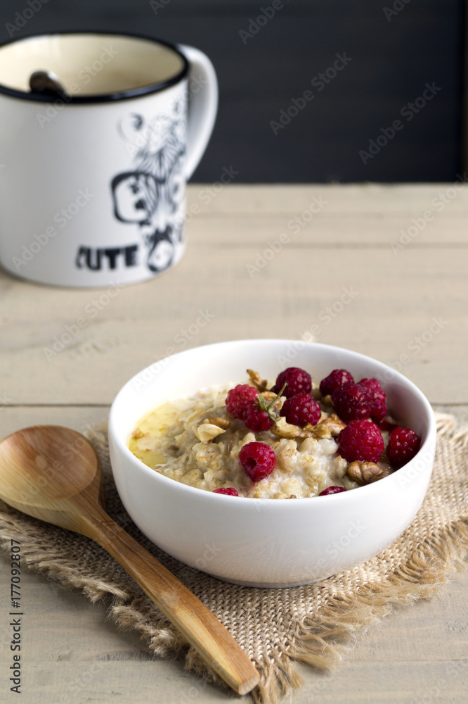 Breakfast with oatmeal and fresh raspberries. Breakfast with oatmeal and fresh raspberries.