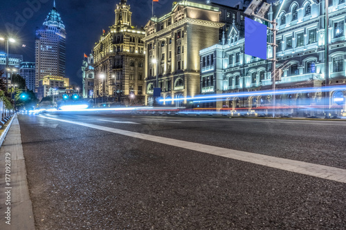 traffic light trails and modern street in shanghai