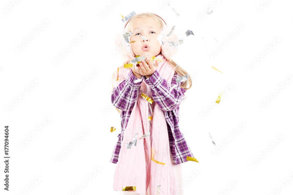 Portrait of little girl wearing scarf and winter ear muffs on white background Portrait of little girl wearing scarf and winter ear muffs on white background