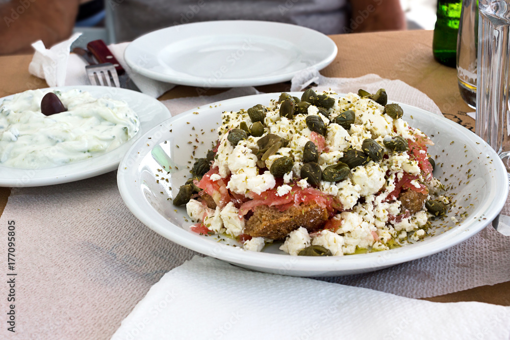 Dakos salad and Tzatziki yogurt sauce, greek meal tipycal. Taken in Naxos
Dakos salad and Tzatziki yogurt sauce, greek meal tipycal. Taken in Naxos