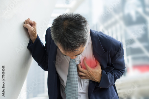 Cuadro en lienzo Business Man in uniform having heart attack / heartburn