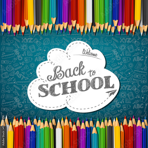 Welcome back to school with colored pencils on chalkboard