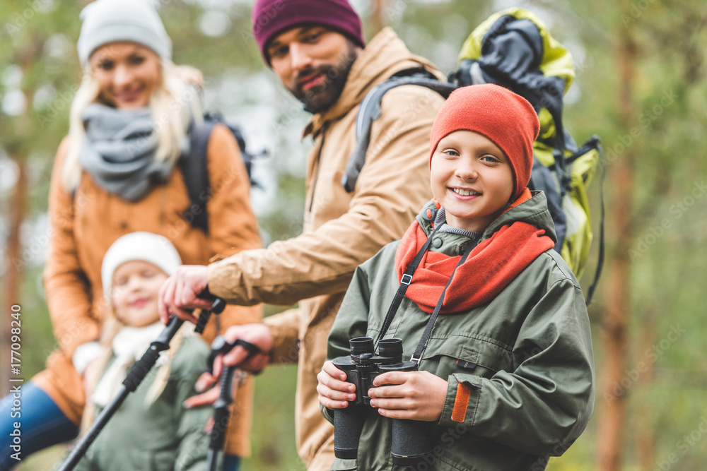 smiling boy with binoculars smiling boy with binoculars