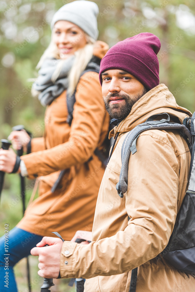 couple trekking in autumn forest couple trekking in autumn forest