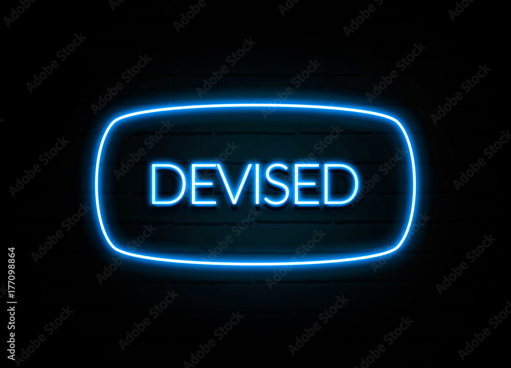 Devised - colorful Neon Sign on brickwall Devised - colorful Neon Sign on brickwall