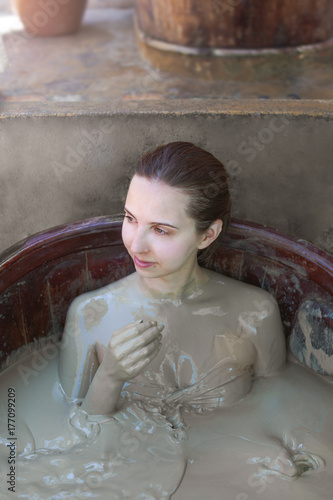 The girl in the mud bath. Concept of relaxation. Nha Trang, Vietnam.