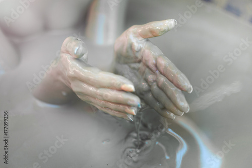 The girl in the mud bath. Concept of relaxation. Nha Trang, Vietnam.