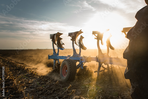 Принти на полотні Tractor plowing fields  -preparing land for sowings