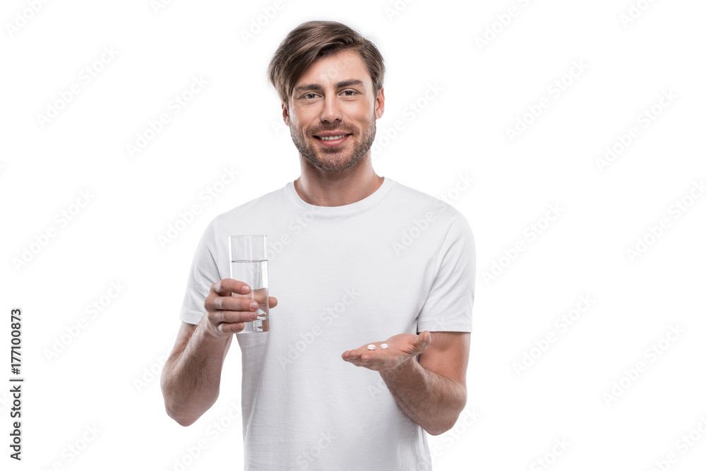 man with pills and glass of water man with pills and glass of water