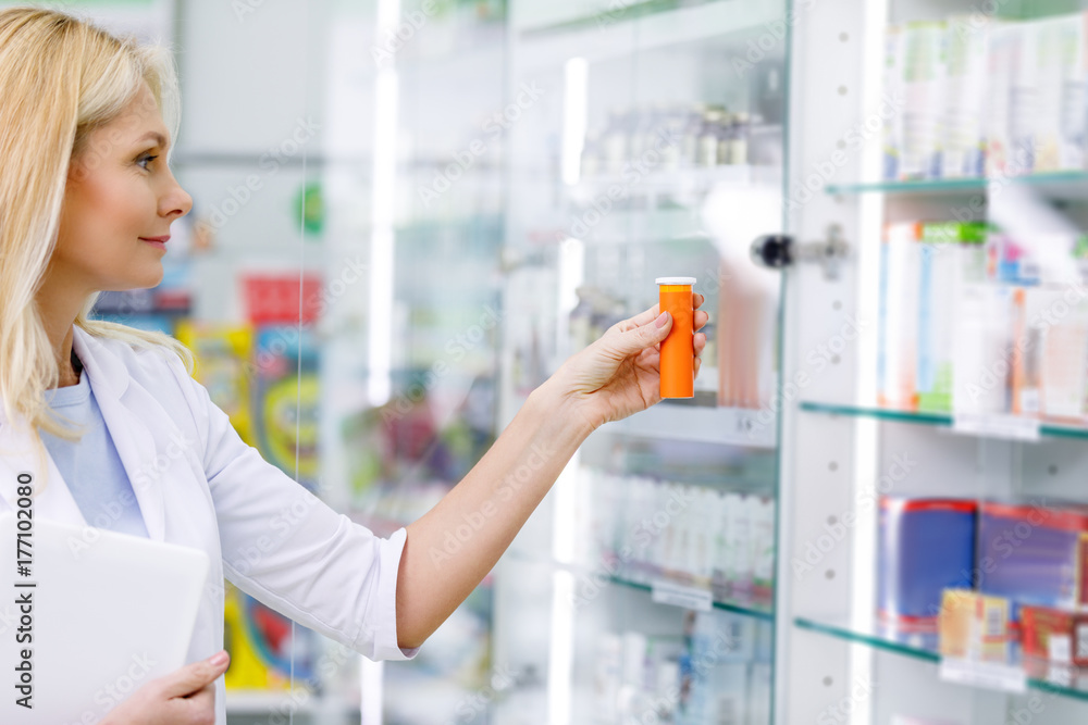 pharmacist with digital tablet and medication pharmacist with digital tablet and medication