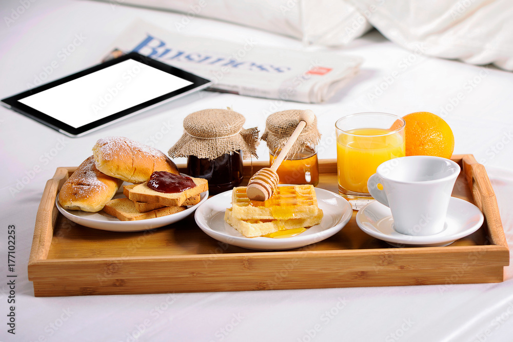 Breakfast in bed. Tray with coffee, croissants and fruits Breakfast in bed. Tray with coffee, croissants and fruits