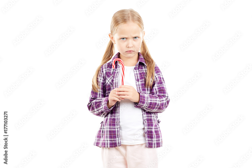 Portrait of cute little girl holding candy cane Portrait of cute little girl holding candy cane