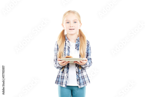 Portrait of beautiful little girl in checked shirt against white background