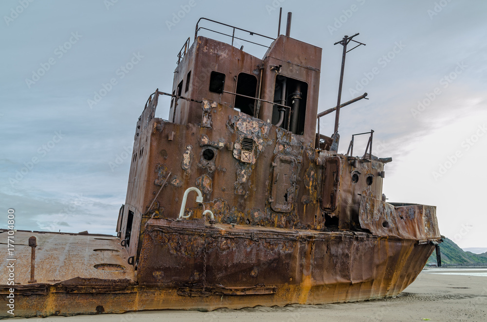 Abandoned ship near the coast.