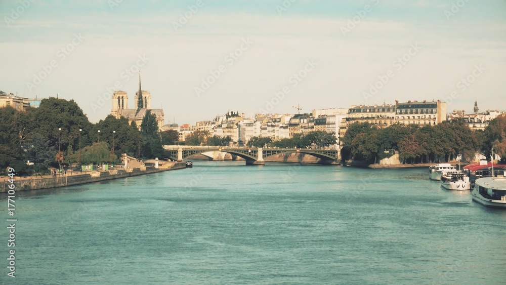 The Seine river embankments and famous Notre-Dame Cathedral