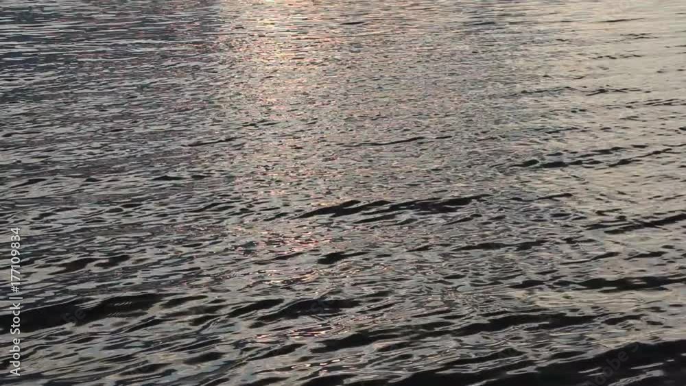 Water in the river at sunset, natural background, Ob River, Siberia, Russia Water in the river at sunset, natural background, Ob River, Siberia, Russia