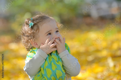 Happy little girl in park