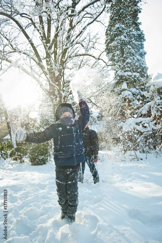 the guys are playing in the snow in the winter