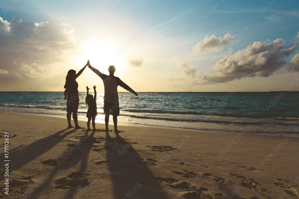 Fototapeta premium happy family with kids play at sunset beach