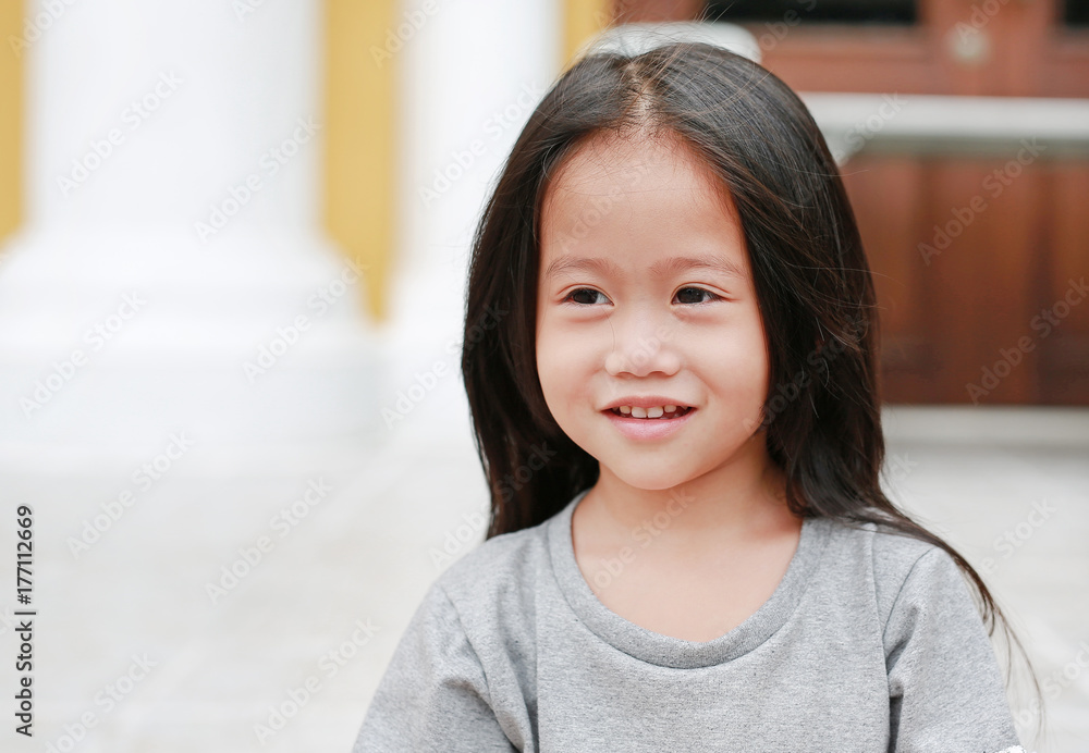 Smiling asian child girl outdoor. Portrait beautiful girl looking something. Smiling asian child girl outdoor. Portrait beautiful girl looking something.