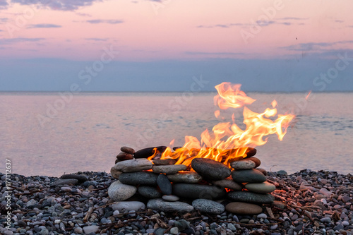 a fire burning in the stone place photo