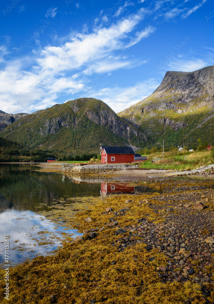Traditional red rorbu cottages at the sea on Lofoten islands in Norway