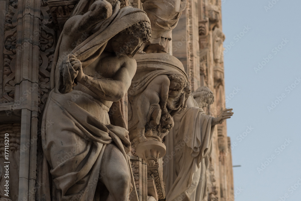 Fototapeta premium sculptures on the facade of Duomo in Milan